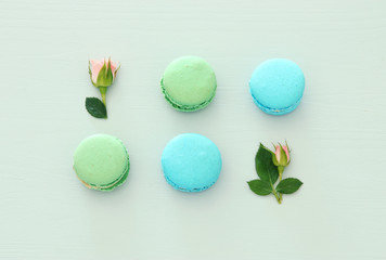 Top view of colorful macaron or macaroon over pastel background. Flat lay.