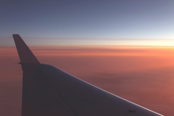 Fototapeta na wymiar Beautiful sunset view from the plane window