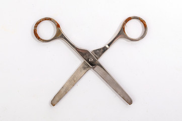 Open rusty steel scissors top view