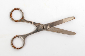 Open rusty steel scissors top view