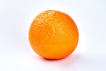 Fresh healthy orange fruit close up. Whole single orange citrus fruit on grey background. Citrus fruits for perfect skin.