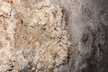 dark grunge texture of old cracked concrete wall, destroyed plaster layer of antique surface