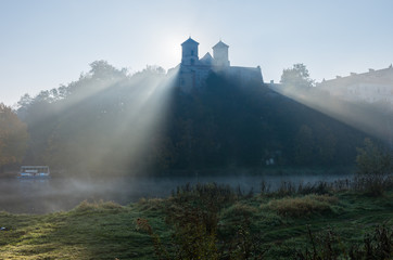 Tyniec abbey in the mists, sunny morning, Krakow, Poland