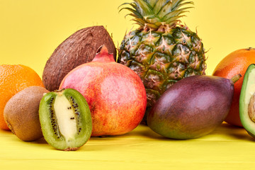Composition from fresh tropical fruits. Set of ripe exotic fruits on colorful background.
