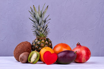 Beautiful composition from tropical fruits. Nutritious food background. Healthy eating concept. Food and love.