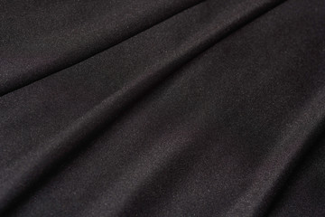 Soft Black Satin Line Folds Texture Close-up