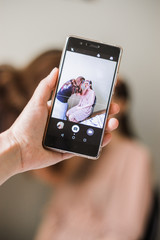 make up artist doing professional make up of young woman. Make-up artist work on her friend.Real people.