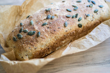 One-piece whole-wheat bread with pumpkin seeds, selective focus