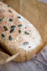 One-piece whole-wheat bread with pumpkin seeds, selective focus