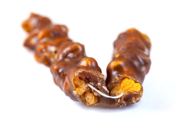 Tasty oriental sweets, churchkhela on  white background. Georgian national dessert