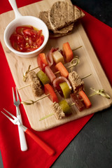 Appetizer: canapés, ham. cheese,  red pepper, pickles andjalapeno in olive oil  