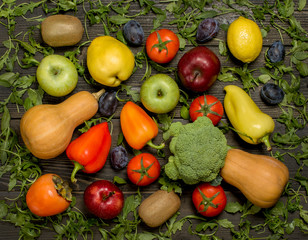 fresh fruits and vegetables on a dark wooden background