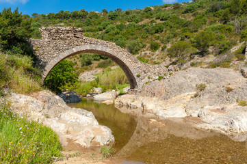 Fototapeta na wymiar Arch bridge Le Pont des Fees in Grimaud-Village