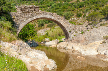 Fototapeta na wymiar Arch bridge Le Pont des Fees in Grimaud-Village