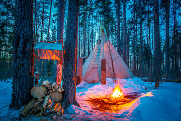 Tipi. Forest in winter. Indian Home. Bonfire in the forest. Ethnography. People of America. Living...