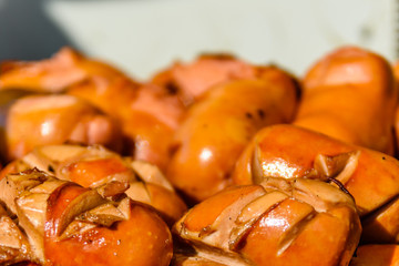 Heap of the fried sausages in steel tray