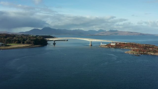 Rising aerial shot of Skye Bridge, Isle of Skye, Scotland, UK