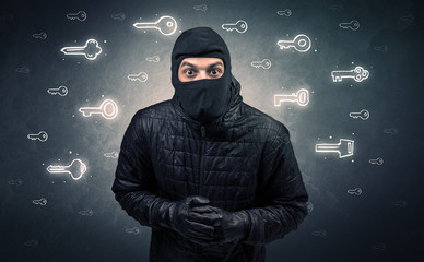 Burglar standing with tools in his hand.