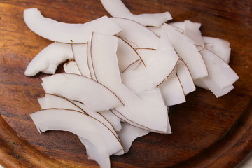 The process of making coconut chips at home slice.