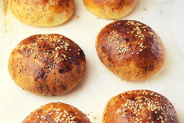 homemade buns close-up with their own hands.