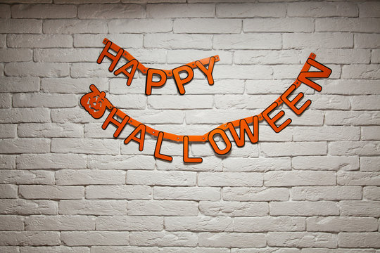Halloween lettering Happy Halloween on a brick wall