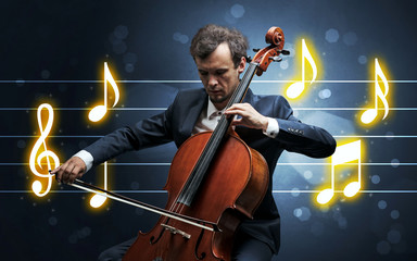 Young handsome cellist playing with music sheet background