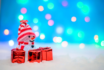Christmas picture with a snowman and gifts