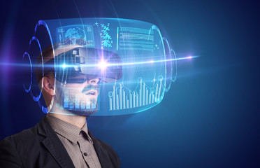 Amazed businessman with high tech 3D projection in front of him 