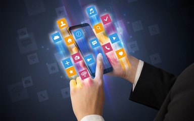 Female hand using smartphone with colorful angular fast switching application icons around
