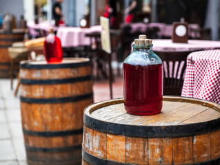 red wine bottle and wooden barrel