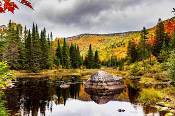 Fall colors of Lac Legault with Mont Kaaikop in the background, in cottage country in the...