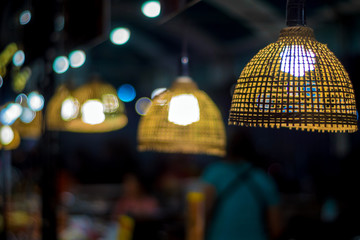 Fototapeta premium Lighting from light bulb in the bamboo weave hanging lamp