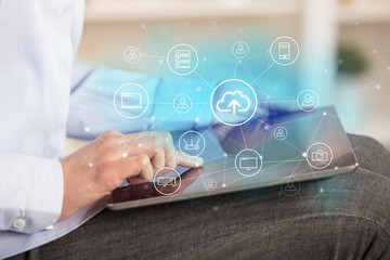 Business woman using tablet with network security and online storage system concept
