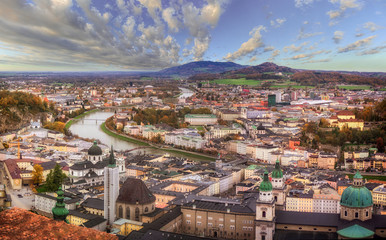 Autumn cityscape of Salzburg, Austria. Panoramic view of Salzburg with Salzach river and cloudy sky