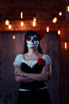 Halloween photo of woman with white make-up on face