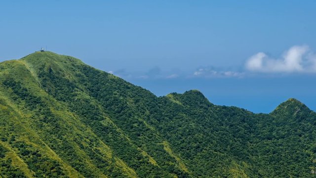 Timelapse of Keelung mountain with blue sky in New Taipei city. Beauty Hyperlapse of landscape of green mountains with long stairs and chinese pavilion. Scenic of a beautiful summer day in Jishan-Dan