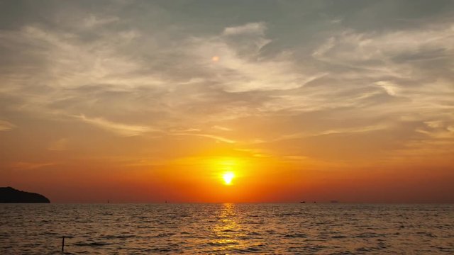Beautiful dramatic light in the sunrise or sunset scenery over sea of nature night to day 4K Time lapse shot 
