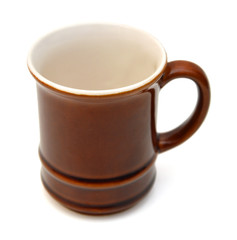 Brown mug empty blank for coffee or tea isolated on white background