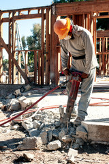 worker using jackhammer