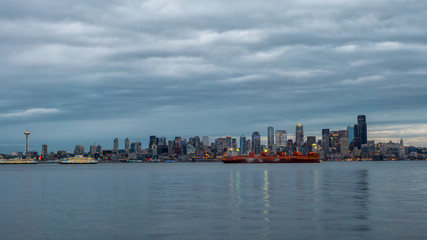 Fototapeta na wymiar Downtown Seattle Light Up at night with Cloudy Skies