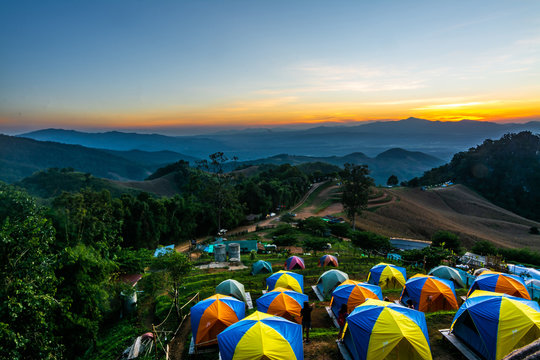 tent in the sunset overlooking mountains