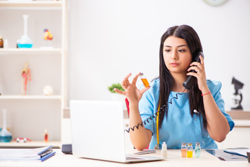 Young beautiful female doctor working in the clinic 