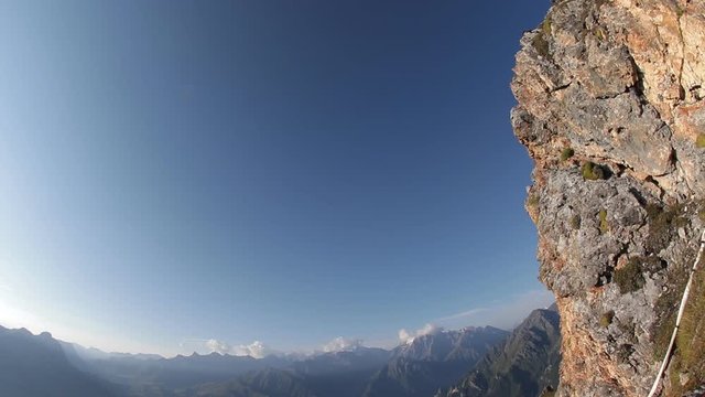 Extreme parachute jump from the top of the mountain. Base jumping, slow motion.