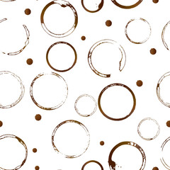 Coffee stains seamless pattern. Brown shape  of coffee cup bottom rings and drop splashes isolated on white. Grunge circles and splatter.