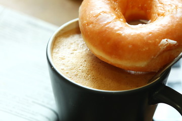 Coffee and donut on the cup scene.