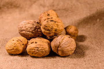 Heap of the walnuts on a sackcloth