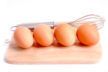 Eggs on a butcher with white background