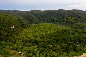 Aerial drone view of mangrove forest surrounded by lush tropical rainforest in Bako, Borneo