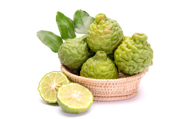 The kaffir lime leaves in the basket on a white background.