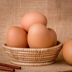 Eggs in a basket on  gunny (sackcloth)  background